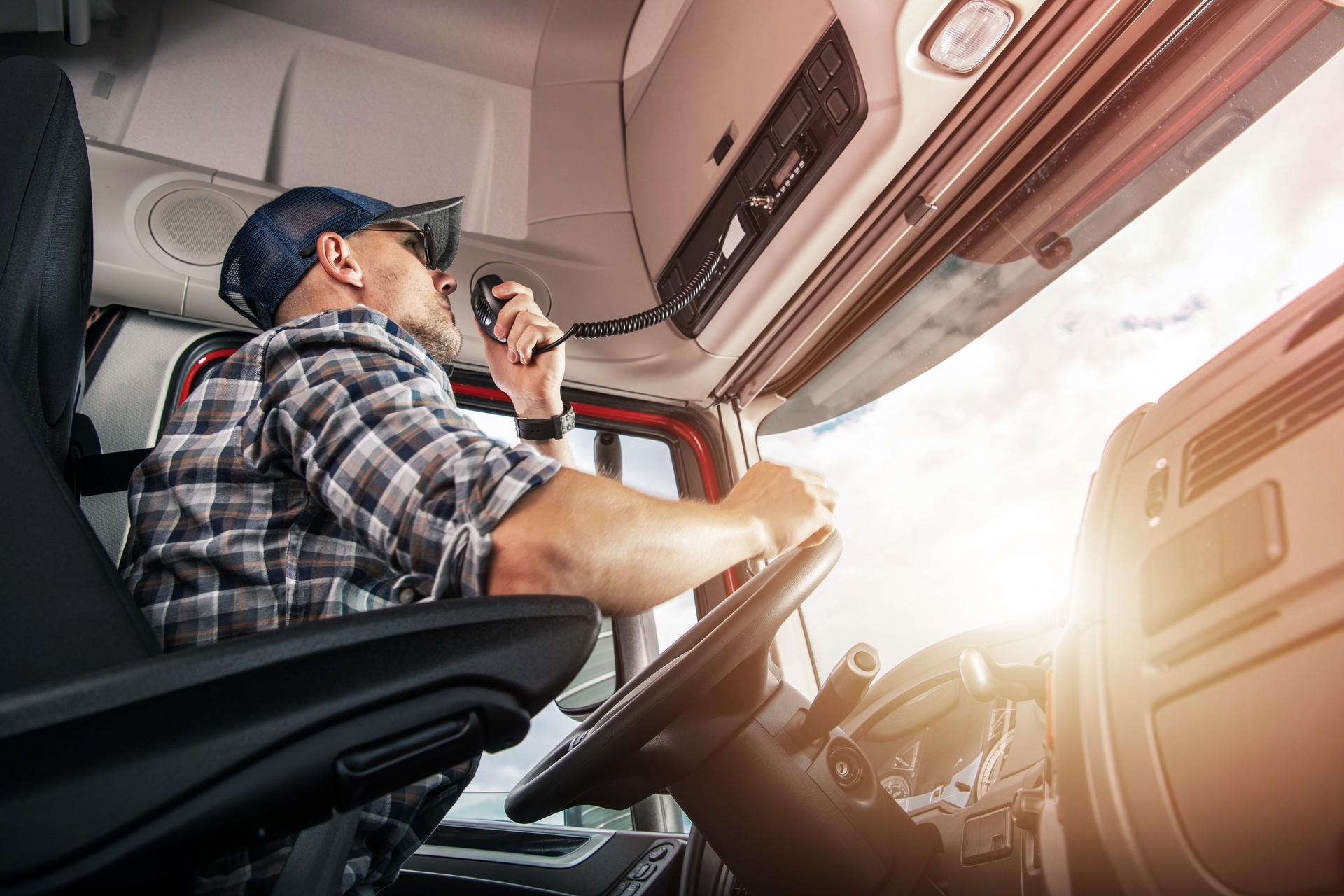 Trucker Having a Conversation via CB Radio on the Route